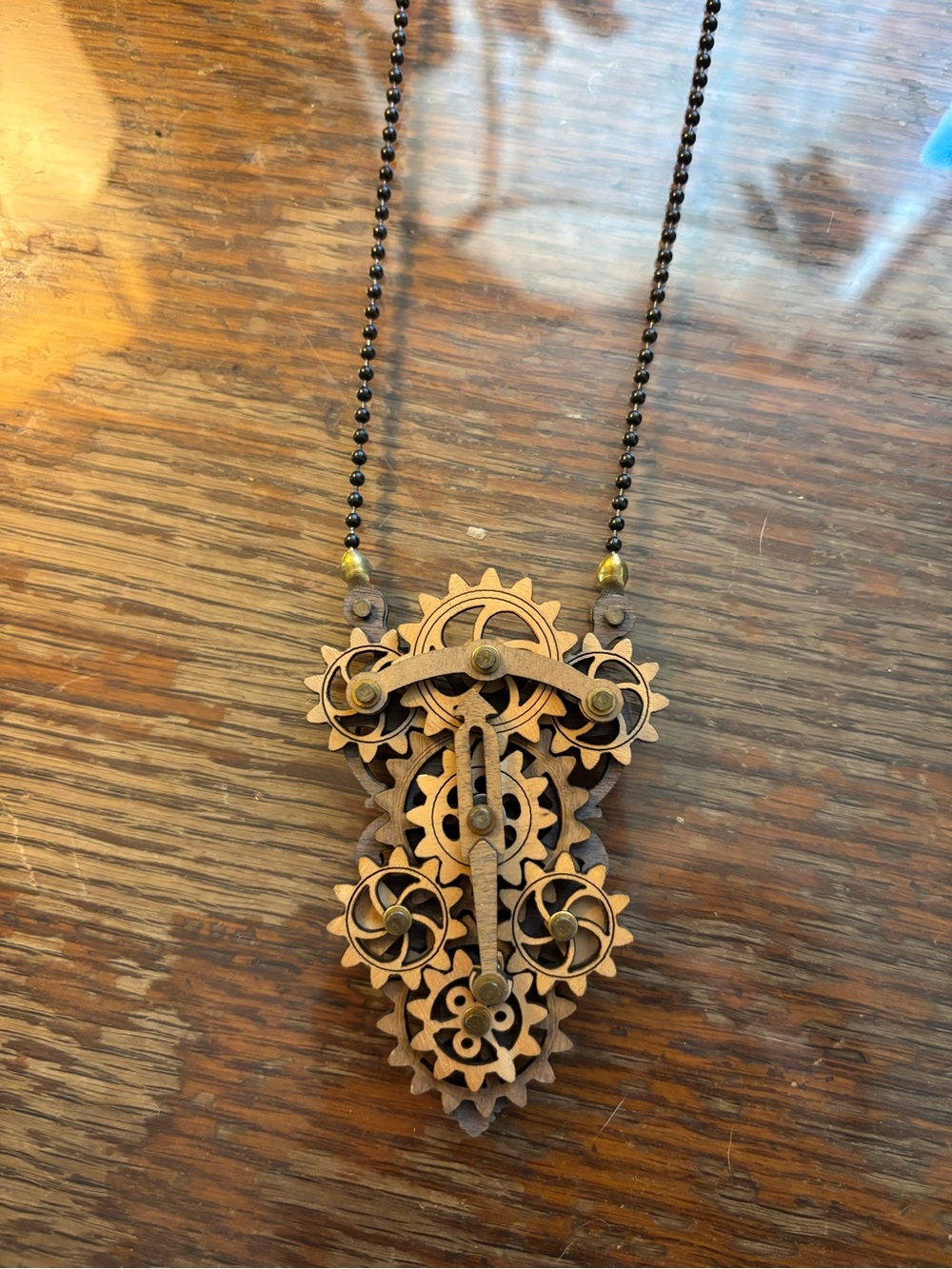 Laser-Cut Wood Piston Gear Kinetic Necklace.